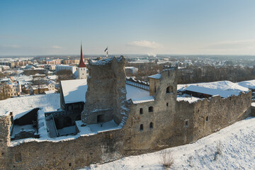 Ruins of the old Rakvere castle in winter, drone view air photography.