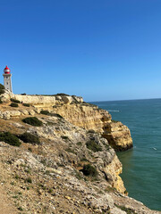Fototapeta na wymiar Cliffside Lighthouse in Portugal