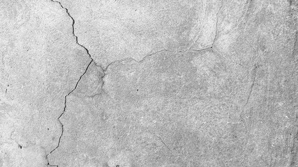Crack wall texture. Cracked concrete wall covered with cement surface as background. Wall fragment with scratches and cracks. Cracked concrete wall covered. Grey stone seamless photo texture. 

