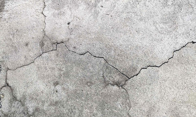 Crack wall texture. Cracked concrete wall covered with cement surface as background. Wall fragment with scratches and cracks. Cracked concrete wall covered. Grey stone seamless photo texture. 