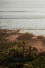 Sandy beach, with a backdrop of beautiful blue ocean and clear sky