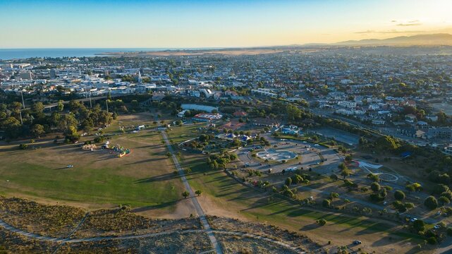 View of the scenic rural landscape of Caroline Bay and Timaru, with lush green fields and trees