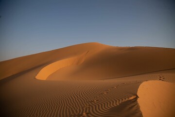 Fototapeta na wymiar Closeup of a beautiful landscape of a desert on a sunny, hot day in Saudi Arabia