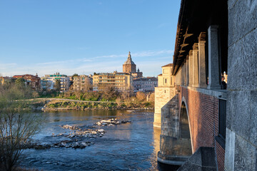 Pavia, Italy April 2023. Ponte Coperto (covered bridge) or the Ponte Vecchio a stone arch bridge...