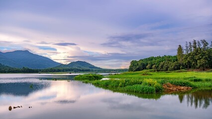 Fototapeta premium Idyllic landscape of a tranquil river with mountains in the background