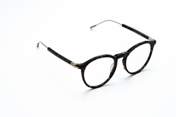 beautiful glasses with thin frames on a white background