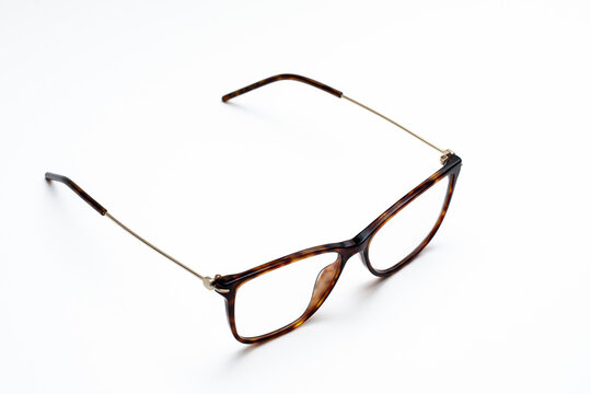 beautiful glasses with thin frames on a white background