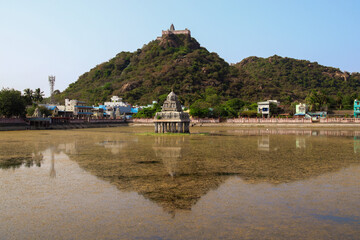 View of Temple and it's reflection in the mid of pond in Chennai city of tamil nadu  