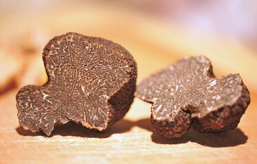 black truffles on a chopping board