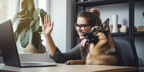 A girl gives her pet a high five. Training your beloved dog at home at the table. Generative AI. - obrazy, fototapety, plakaty