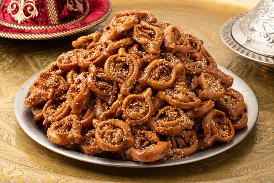 Plate with fresh baked chebakia for iftar close up on the table 
