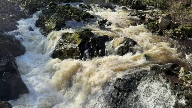 River Dee fast flowing due to high water level during the winter at the Bridge of Feugh