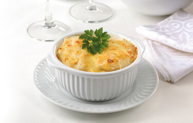 Gratin cod with bechamel and cheese..