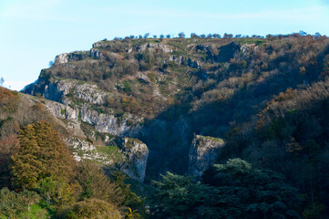Fototapeta na wymiar Cheddar Gorge, Mendips, Somerset, with people in the far distance on the top of the rocks