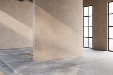 A large room with a wall and a window. The room is empty and has a very clean and simple design