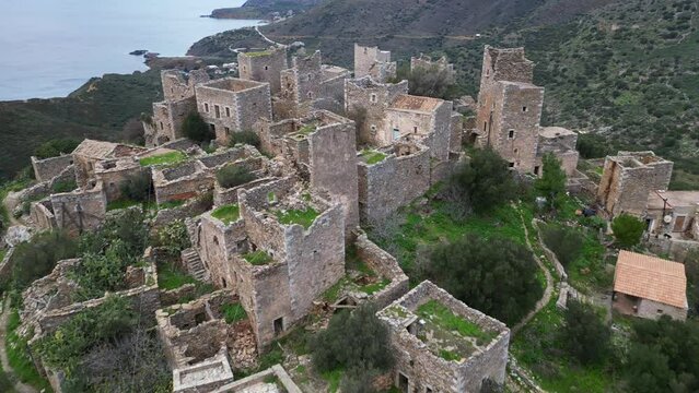 Greece Peloponneso , drone aerial view of Vatheia is a village on the Mani Peninsula, in south-eastern Laconia - abandoned and uninhabited stone village - rural country of Greece