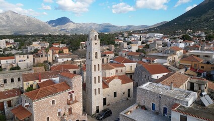 Naklejka na ściany i meble Iconic aerial scenery over the old historical town of Areopoli Lakonia, Greece - Mani Peninsula Peloponnese - drone aerei view old historic traditional village 