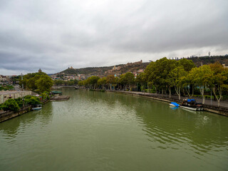 The beautiful view of kura river in tbilisi city, Georgia. - obrazy, fototapety, plakaty