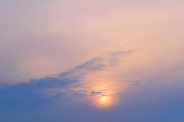 Summer evening sky in the picturesque clouds, lit by the rays of the setting sun.