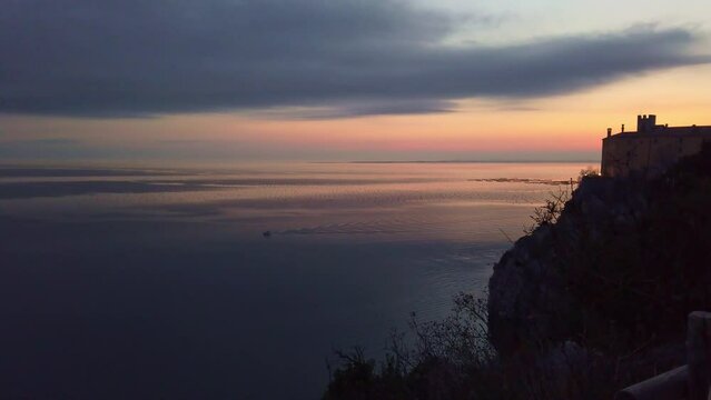View of the Adriatic sea after the sunset near the Duino castle on the Trieste coast, Italy