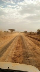 Naklejka premium Dusty road to a food distribution center, journey for sustenance