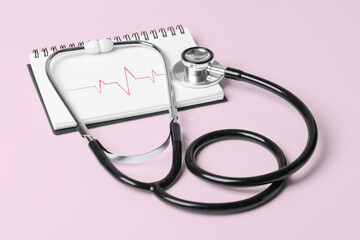 Stethoscope and Pulse Heartbeat Notebook Still Life Object Medication Accessories on Pink Background