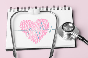 Stethoscope and Pulse Heartbeat Notebook Still Life Object on Pink Background