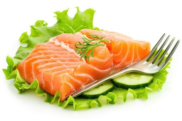 Fresh piece of raw salmon on green lettuce leaf and cucumber pieces with fork Isolated on solid white background