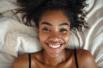 Happy smiling African beauty woman who recently woke up after a healthy and good sleep in bed - obrazy, fototapety, plakaty