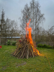 An Easter fire burns in the meadow