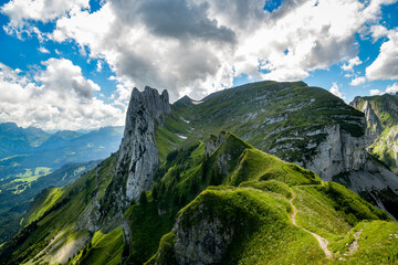 Walking trail on ridge leading to Saxer Lucke pass in Swiss Alps