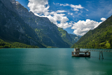 Beautiful Klontalersee surrounded by steep mountains in Switzerland