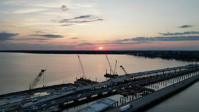 Aerial view of the vehicles driving on Hampton Roads Beltway at sunset in Fort Monroe, Virginia, USA