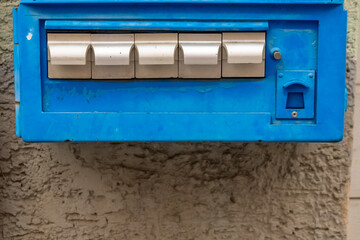 an old blue cigarette machine