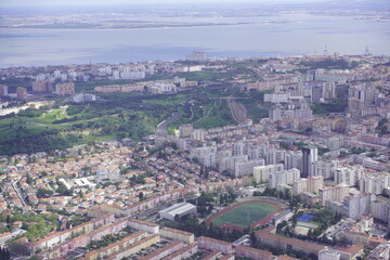 Fototapeta premium Aerial view of Lisbon, with the Tejo River in the background. Lisbon, Portugal.