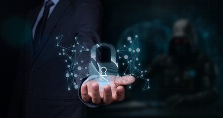 cybersecurity concept: businessman holding a hologram of a padlock in his hand. black background