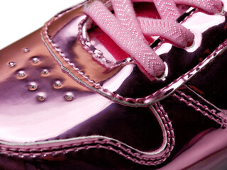 closeup of leather pink shiny kid or child shoe