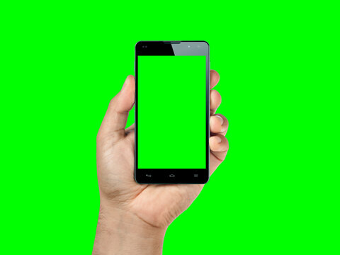 Closeup hand holding and showing smartphone or mobile with green screen isolated on green