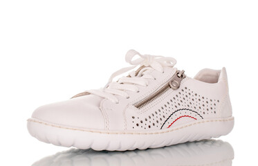 One female sneaker, macro, isolated on white background.