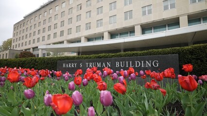 Front turning view of Harry S Truman Department of State building in Washington, DC on an overcast...