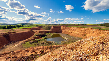 Crushed stone quarry on a sunny spring day. - 772424833