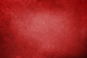 Red textured concrete wall background. Dark edges