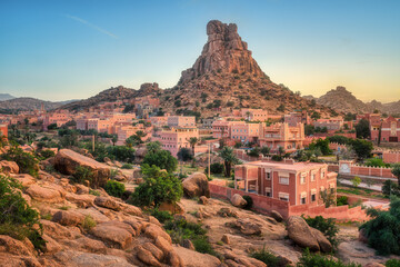 Tafraout town and Napoleon's Hat rock, Atlas mountains, Morocco, in sunset light