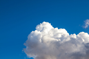 Naklejka na ściany i meble White Fluffy Cloud in a Clear Blue Sky