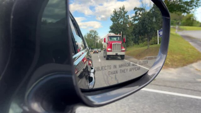 Dump truck in rear view mirror while driving 4k