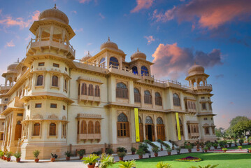 Grand Traditional Indian Palace at Dawn or Dusk, Rajasthan, with Ornate Domes and Lush Gardens