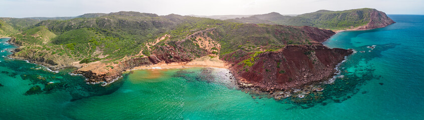 Aerial drone view of Cala del Pilar beach scenery of Menorca, near Ferreries