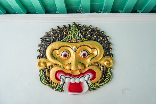 Yogyakarta, Indonesia - February 1, 2024: Kalamakara, the god of repelling evil in Keraton Yogyakarta. Demon face hanging on Jogja Sultan Palace Wall