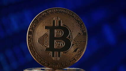 gold bitcoin in the background of a binary code. Digital wallet icon.