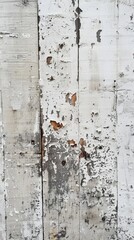 Vertical framing of a white painted surface, its weathered state highlighted by peeling paint and streaks of decay.